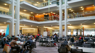 group study area with tables, chairs, and natural light