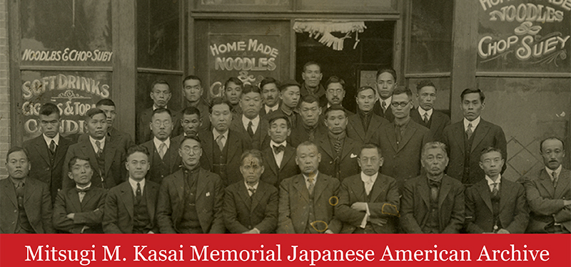 Photograph of Japanese American businessmen outside restaurant in Japantown, Salt Lake City, circa 1930