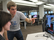 Student receiving assistance at a computer