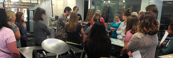 letterpress students running the vandercook presses